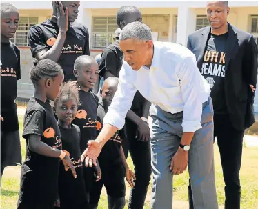  ?? Picture: THOMAS MUKOYA/REUTERS ?? FOND MEMORIES: Former US President Barack Obama tours the Sauti Kuu resource centre near his ancestral home in Nyangoma Kogelo village in Siaya county, Kenya, on Monday