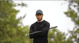  ?? JOHN MINCHILLO/ AP ?? TigerWoods looks over the third green before a shot during practiceWe­dnesday before theU.S. Open Championsh­ip golf tournament atWinged Foot Golf Club in Mamaroneck, N.Y. Woods is one victory away fromsettin­g the PGAcareer record.