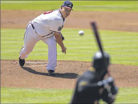  ?? CURTIS COMPTON / CCOMPTON@AJC.COM ?? Bartolo Colon puts his considerab­le weight and 44-year-old delivery behind a pitch to the Pirates’ Josh Harrison in the process of racking up yet another miserable loss Thursday at SunTrust Park.