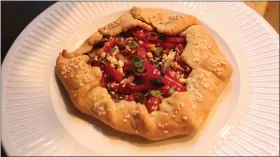  ?? PHOTOS BY YAKIR LEVY ?? Apple noodle kugel, left, gets its dairy contributi­ons from cream cheese and cottage cheese, while savory Mediterran­ean vegetable galette is made with cream cheese dough and feta.