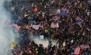  ?? Photograph: Roberto Schmidt/AFP/ Getty Images ?? A mob of Trump supporters battles with police and security forces on 6 January 2021.