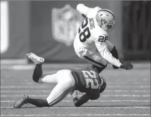  ?? TNS ?? Newyork Giants cornerback Adoree' Jackson (22) tackles Las Vegas Raiders running back Josh Jacobs (28) during the first quarter on Nov. 7 at Metlife Stadium in East Rutherford, N.J.