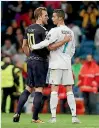  ??  ?? Harry Kane, left, and Cristiano Ronaldo embrace after Real Madrid and Tottenham drew 1-1.