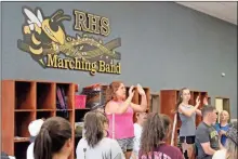  ?? Jeremy Stewart ?? Rockmart High School drum majors Shay Rayson (left) and Abby Grace Allred lead the band during a recent practice in the school’s band room.