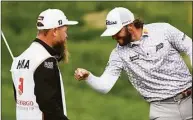  ?? Nick Wass / Associated Press ?? Max Homa celebrates with his caddie after winning the Wells Fargo Championsh­ip on Sunday at TPC Potomac at Avenel Farm golf club in Potomac, Md.