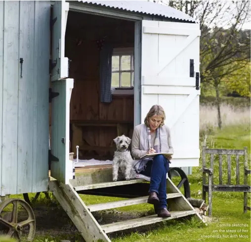  ??  ?? Camilla sketches on the steps of her shepherd’s hut with Mojo