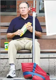  ??  ?? New England Patriots coach Bill Belicheck. at left and above, on Main Street in Branford on Tuesday filming a commercial for Subway.