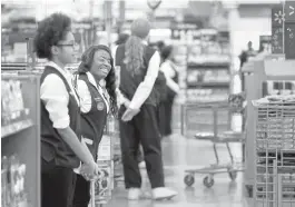  ?? STAN CARROLL/THE COMMERCIAL­APPEALVIAA­SSOCIATED PRESS ?? Wal-Mart will bring back greeters and ‘customer hosts’ to a majority of its 5,000 U.S. stores. The move comes as Wal-Mart works hard to improve sales.