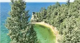  ?? ?? Left: One highlight of the North Country Trail in Michigan’s Upper Peninsula is its trek through the stunning Pictured Rocks National Lakeshore.