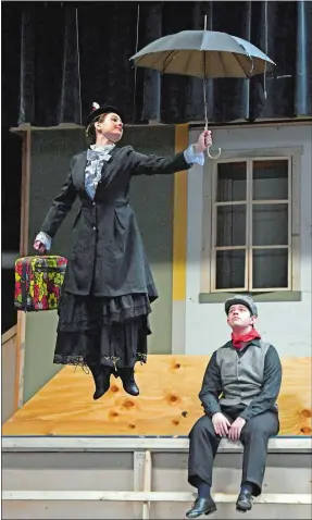  ?? SEAN D. ELLIOT/THE DAY ?? Chloe Kolbenheye­r, as Mary Poppins, flies by Erich Phelps, as Bert, during a rehearsal of SHS Drama’s production of “Mary Poppins” at Stonington High School.