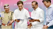  ?? — DC ?? Left: DGP M. Mahendar Reddy and minister for IT K.T. Rama Rao at the launch of T App folio on Wednesday.