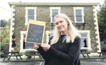  ?? PHOTO: GREGOR RICHARDSON ?? Pub without water . . . Careys Bay Hotel owner Jo Kidston was forced to close her doors yesterday — for the fourth time in a year — after a Dunedin City Council water main failed yet again.