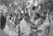  ??  ?? SP workers celebrate their party success in Allahabad on Wednesday