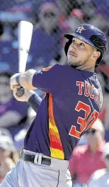  ?? Photos by Karen Warren / Staff photograph­er ?? Astros outfielder­s Josh Reddick, left, and Kyle Tucker were both aiming for the starting lineup before the pause of spring training. Reddick went 1 for 20 and Tucker 8 for 29.