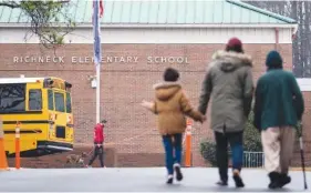  ?? BILLY SCHUERMAN/THE VIRGINIAN-PILOT VIA AP ?? Students return to Richneck Elementary on Jan. 30 in Newport News, Va.