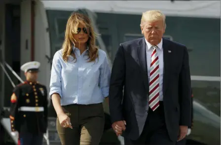  ?? JACQUELYN MARTIN — THE ASSOCIATED PRESS ?? President Donald Trump, with first lady Melania Trump, walks toward the media before speaking in Morristown, N.J., Sunday.