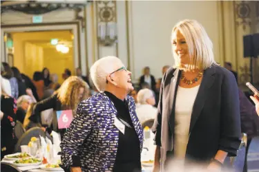  ?? Photos by Lea Suzuki / The Chronicle ?? Susan F. Rice (left) talks with Stephanie Schriock, the president of Emily’s List, an organizati­on devoted to electing prochoice Democratic women. Schriock’s advice to Democrats: “Stop wringing your hands.”