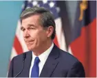  ?? ETHAN HYMAN/THE NEWS & OBSERVER VIA AP ?? North Carolina Gov. Roy Cooper, a Democrat, says science will dictate the reopening of his state, including mass gatherings.
