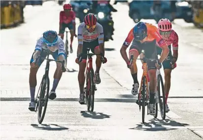  ?? KENNETH K. LAM/BALTIMORE SUN ?? Sep Vanmarcke, left, overtook Nickolas Zukowsky, second from right, to win the Maryland Cycling Classic on Sunday in Baltimore.