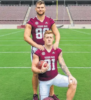  ?? Courtesy Trevor Wood ?? A&amp;M tight ends Trevor Wood, top, and Jace Sternberge­r did a much better job on the field this season than they did in re-enacting the family photo from the movie “Step Brothers.”