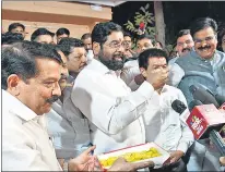  ?? BHUSHAN KOYANDE / HT PHOTO ?? Maharashtr­a CM Eknath Shinde and party workers celebrate after ECI hands ‘Shiv Sena’ name and ‘Bow and Arrow’ symbol to his faction.