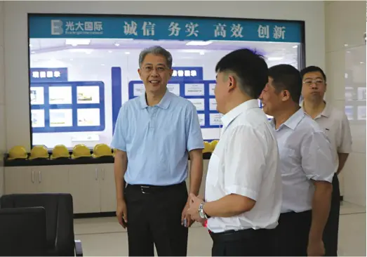  ??  ?? China Everbright Group Chairman Li Xiaopeng (center) inspects a waste-to-energy plant in Sanya, south China’s Hainan Province, on May 22