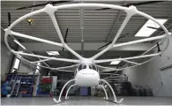  ?? — Bloomberg ?? A Volocopter 2X multirotor electric helicopter stands in a hangar at the Volocopter headquarte­rs in Bruchsal.