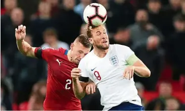  ??  ?? I got this: England’s Harry Kane (right) vying for the ball with the Czech Republic’s Pavel Kaderabek during the Euro 2020 qualifier at Wembley on Friday. — Reuters