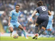  ?? Dave Thompson / Associated Press ?? Manchester City’s Raheem Sterling, left, challenges for the ball with Wolverhamp­ton’s Ruben Neves on Saturday.