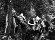  ?? LIU CHAOFU / FOR CHINA DAILY ?? Villagers fire guns during a performanc­e for tourists in Biasha village, Guizhou province, in October.