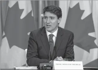  ?? CP PHOTO ?? Prime Minister Justin Trudeau delivers opening remarks as he meets with members of the Canadian Chamber of Commerce and Canada-ASEAN Business Council in Singapore, Singapore on Tuesday.