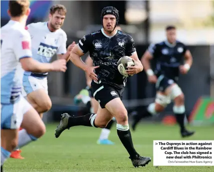  ?? Chris Fairweathe­r/Huw Evans Agency ?? > The Ospreys in action against Cardiff Blues in the Rainbow Cup. The club has signed a new deal with Philtronic­s