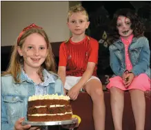  ??  ?? Ella Dorgan with her brother, Jack; sister Aibí – and her prizewinni­ng chocolate and salted caramel cake.