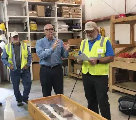  ?? Josh Funk, Associated Press file ?? Niocorp Developmen­ts CEO Mark Smith talks to a group of investors during a tour in October about the prospects for a proposed mine the company hopes to build near Elk Creek in southeast Nebraska to extract rare elements.