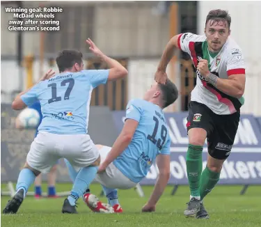  ??  ?? Winning goal: Robbie
McDaid wheels away after scoring Glentoran’s second