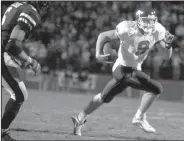  ?? Democrat-Gazette file photo ?? Arkansas freshman quarterbac­k Matt Jones rushed for 110 yards in the victory over Ole Miss in 2001. He ran for two touchdowns, passed for another and completed a pair of two-point conversion passes — all in the overtime periods.