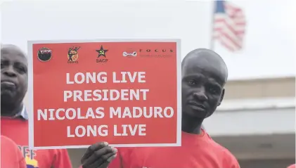  ?? Picture: Refilwe Modise ?? SA Communist Party members outside the US Consulate office in Sandton yesterday, as part of their show of support for the Venezuelan government.