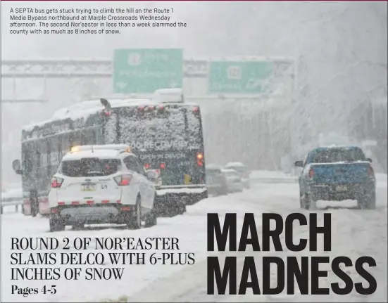  ?? PETE BANNAN – DIGITAL FIRST MEDIA ?? A SEPTA bus gets stuck trying to climb the hill on the Route 1 Media Bypass northbound at Marple Crossroads Wednesday afternoon. The second Nor’easter in less than a week slammed the county with as much as 8 inches of snow.