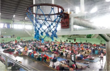  ??  ?? Villagers rest at a temporary shelter outside of the Mt. Agung volcano in Klungkung, Bali, Indonesia, on Saturday. (AP)