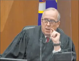  ?? The Associated Press ?? Hennepin County Judge Peter Cahill presides over pretrial motions before continuing jury selection Monday in the trial of former police officer Derek Chauvin in Minneapoli­s.