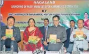  ?? PTI FILE ?? Union defence minister Nirmala Sitharaman (second from left) and Union MOS for home Kiren Rijiju (second from right) at the release of the BJP party manifesto for Nagaland.