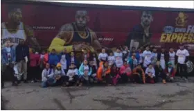  ?? KEVIN MARTIN — THE MORNING JOURNAL ?? Members of the Boys and Girls Clubs of Lorain County gather in front of the Cleveland Cavaliers team bus where they took part in Fit as a Pro Night on Jan. 19.