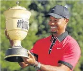  ?? Picture: REUTERS/MATT SULLIVAN ?? GRIPPING STUFF: Tiger Woods of the US holds the WGC-Bridgeston­e Invitation­al trophy in 2013 – his last tour victory before snapping up the Tour Championsh­ip this past Sunday.
