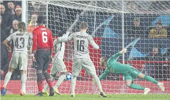  ??  ?? Manchester United goalkeeper David De Gea, right, makes a save against Young Boys.