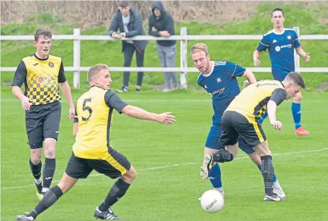  ??  ?? Luncarty and Broughty Athletic (blue) shared the points in a 2-2 Super League draw at Brownlands Park.