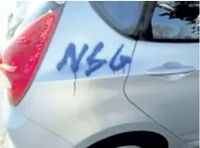  ?? SUBMITTED PHOTO ?? This graffiti was spray-painted Monday night on the side of a car owned by a north-end resident.