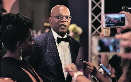  ?? Gareth Cattermole / Getty Images ?? Tony award-winning actress LaTanya Richardson and actor Samuel L Jackson attend the opening night gala of the 13th annual Dubai Internatio­nal Film Festival at the Madinat Arena.