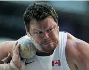  ?? ADRIAN DENNIS/AFP/GETTY IMAGES ?? Canada’s Dylan Armstrong shows his intensity during the men’s shot put final at the world championsh­ips in Moscow Friday. ‘I just feel amazing,’ he said after winning bronze.