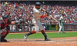  ?? JOSE CARLOS FAJARDO – STAFF PHOTOGRAPH­ER ?? The Giants’ Kevin Pillar connects for a two-run single in Sunday’s game against the Arizona Diamondbac­ks at Oracle Park. Pillar drove in five runs in the Giants’ 10-4victory.