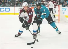  ?? STAN SZETO / USA TODAY SPORTS ?? Samuel Girard of the Colorado Avalanche battles with Evander Kane of San Jose Sharks in a game earlier this month. An unidentifi­ed Avs player has tested positive for COVID-19.